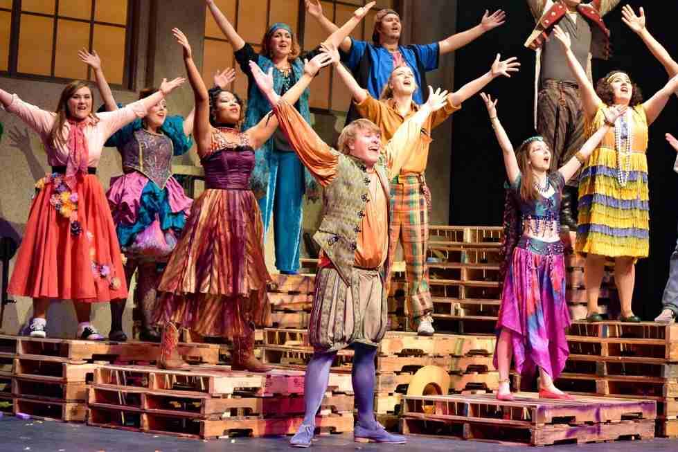 students on stage in a performance